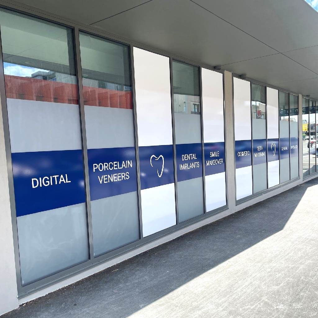 Window signage for a dentist in Ivanhoe