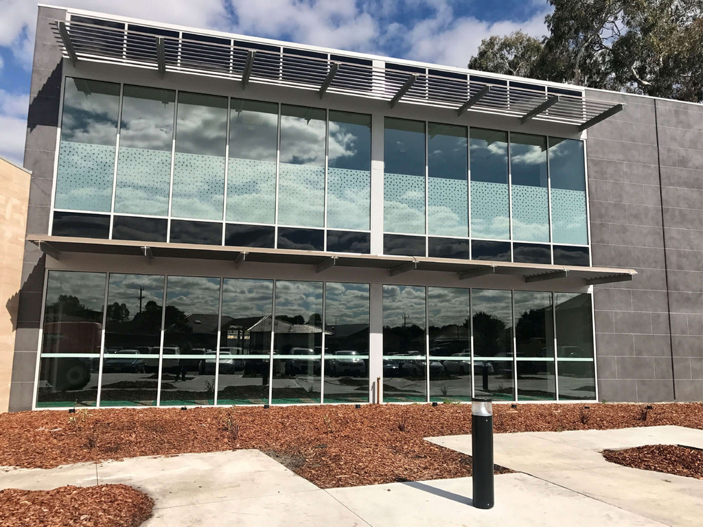 Office building with frosted film and safety decals