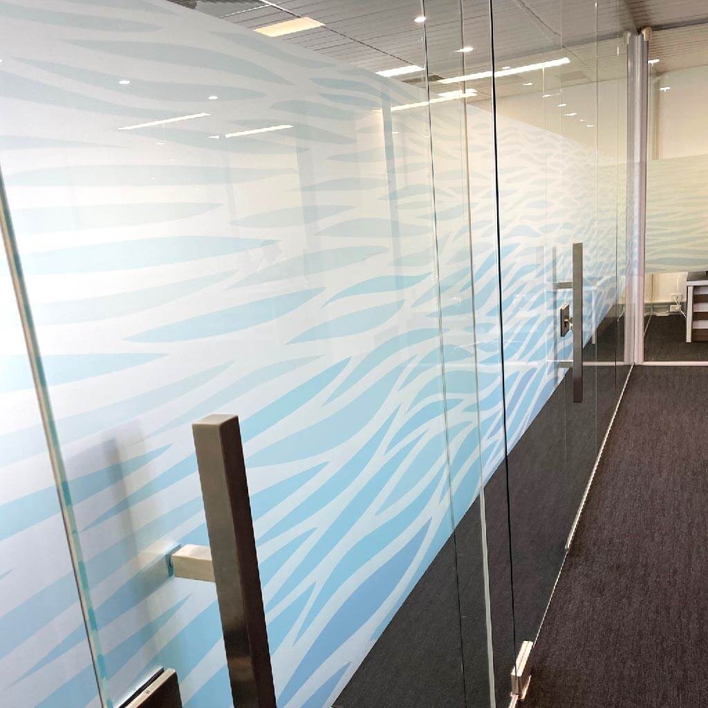 Wave Pattern printed frosted window film band installed on office glass