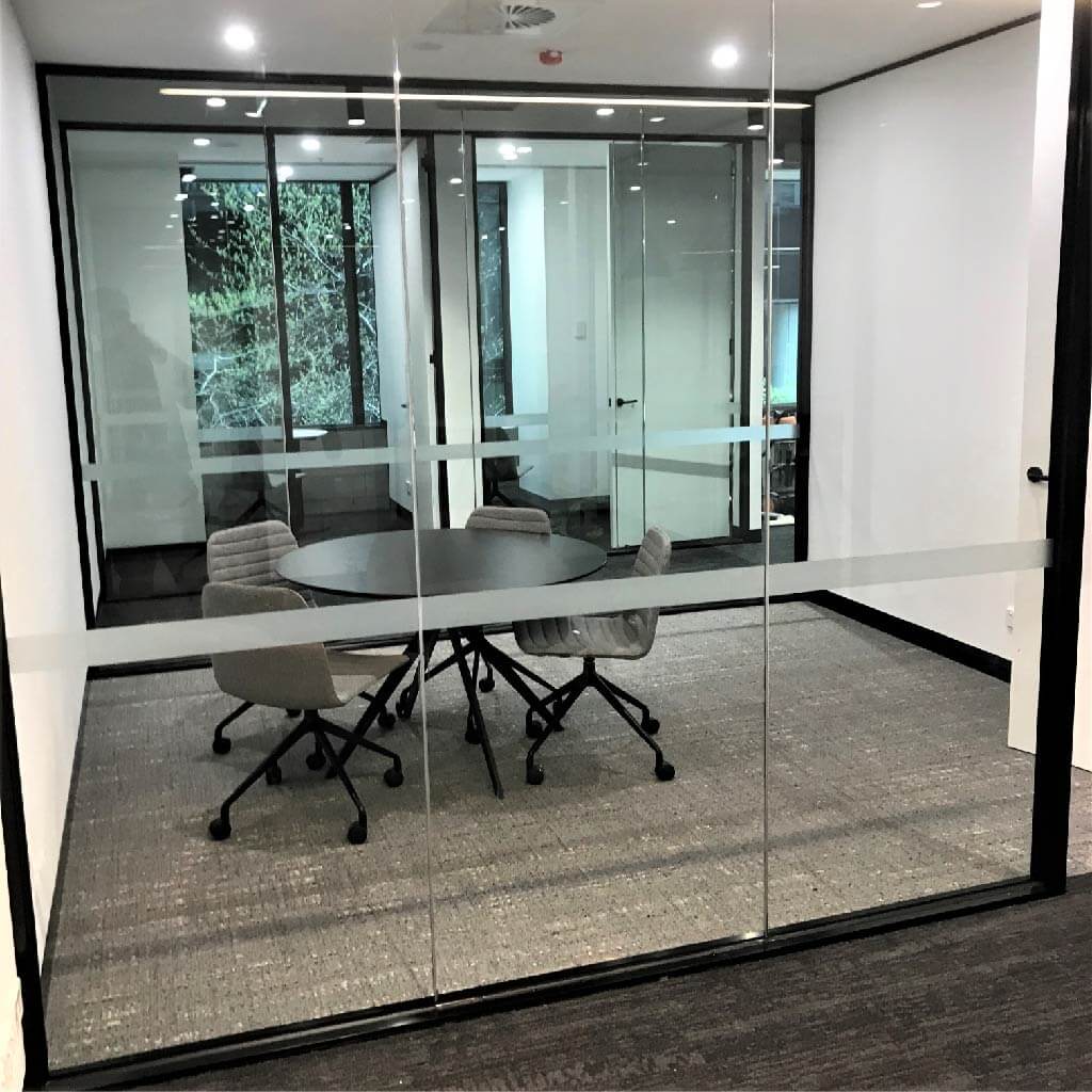 meeting room with safety decal markings on glass