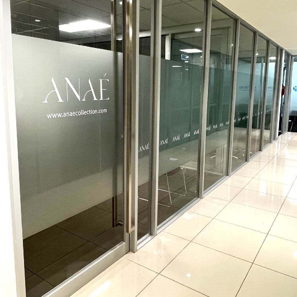 Anae signage and custom decals installed on glass